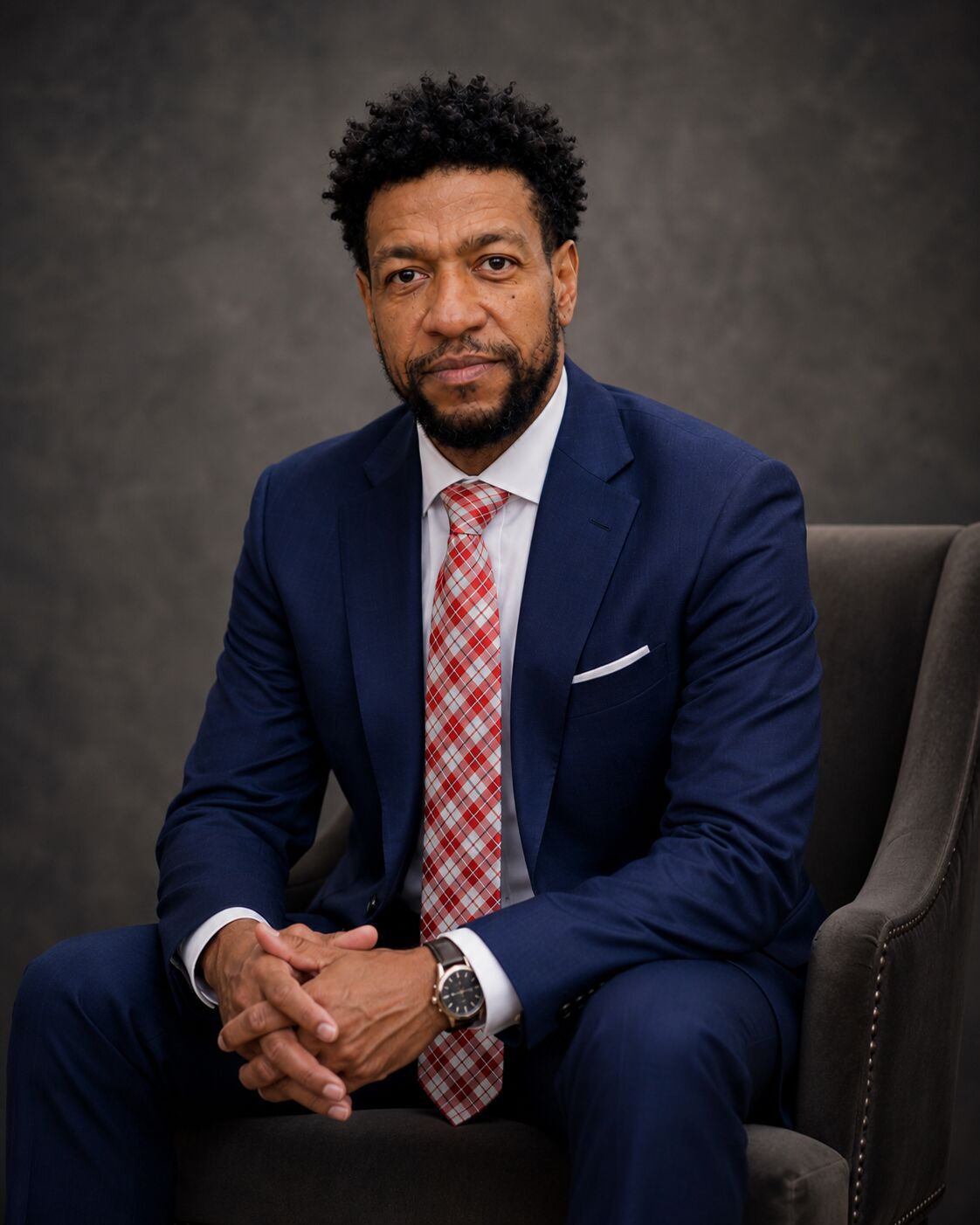 Jerome Matthews seated for a studio portrait